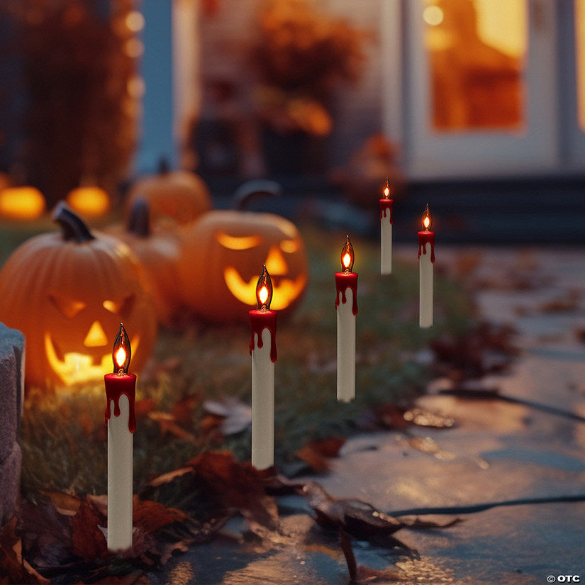 1 Piece(s): Lighted Flickering Candle Halloween Pathway Marker Lights - 4' Black Wire - 5ct | USA Decoration®