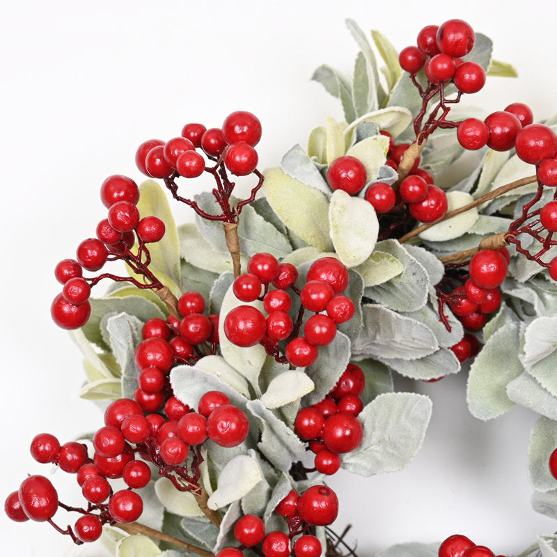 24" Pre-Lit Christmas Wreath hung on a wooden door