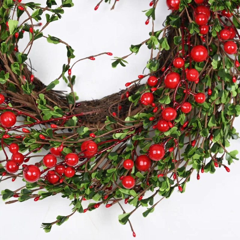 24" Pre-Lit Flocked Pine Christmas Wreath hung on a wooden door