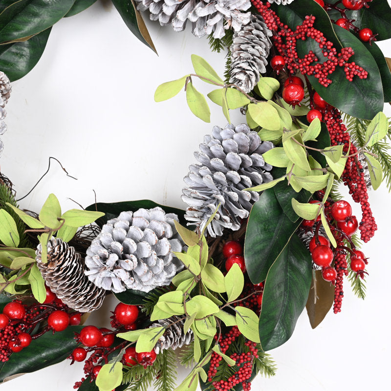 18" Artificial Pine Christmas Wreath hanging on a front door