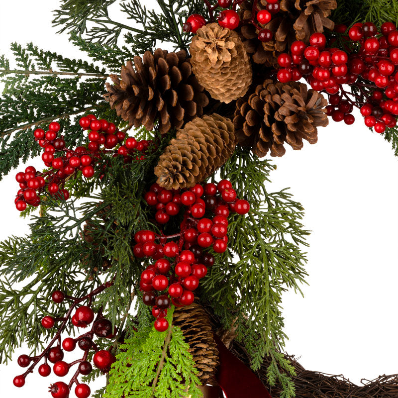 20" Flocked Artificial Pine Christmas Wreath as a festive door display