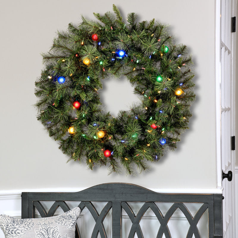 36" Pre-Lit Christmas Wreath hung on a wooden door