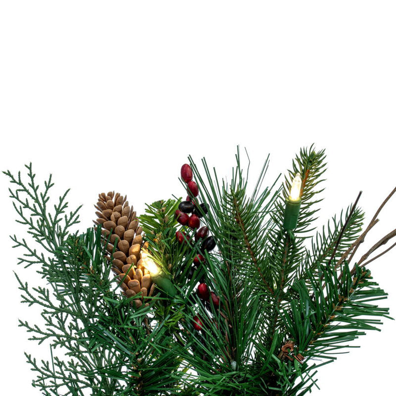 Artificial Pine Christmas Wreath hung on a wooden door
