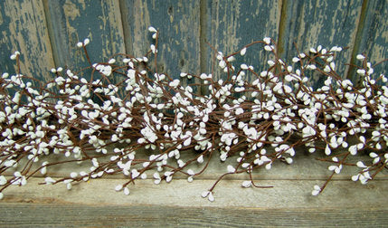 4 ft Artificial Berry Christmas Garland wrapped around a staircase banister