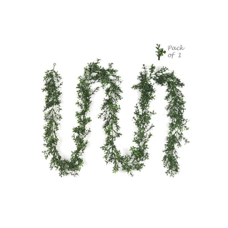 9 ft Pre-Lit Artificial Fir Christmas Garland wrapped around a staircase banister