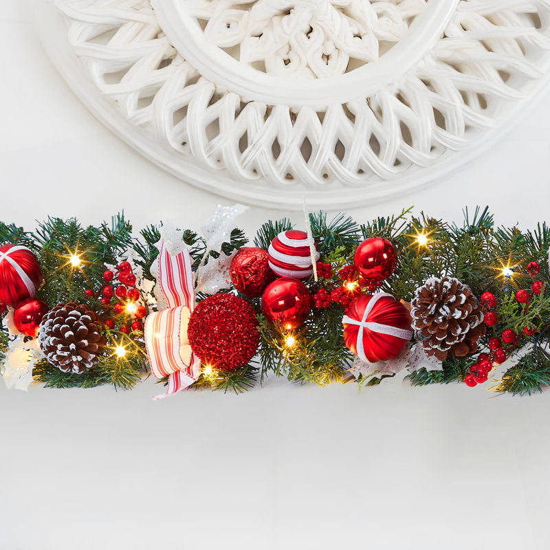 Pre-Lit Artificial Pine Christmas Garland framing a front door