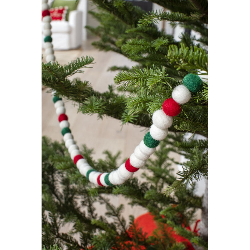 5.9 ft Artificial Berry Christmas Garland styled along a festive mantel