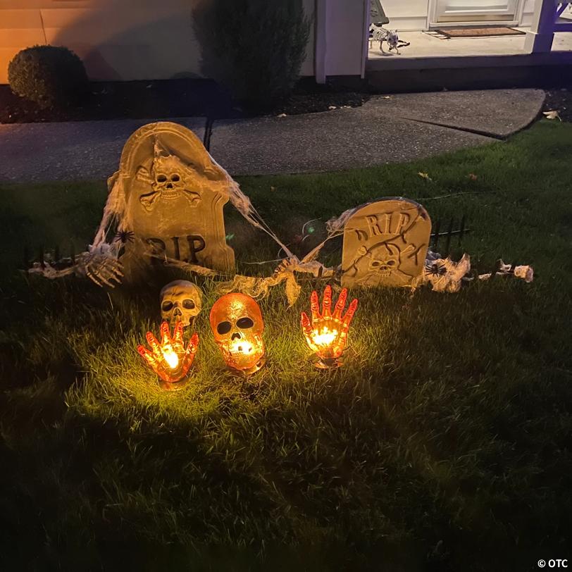 8.5" Lighted Orange Skull and Hands Outdoor Halloween Decoration - 4ft Black Wire