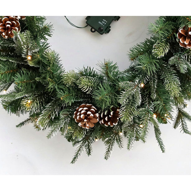 Artificial Fir Christmas Wreath hung on a wooden door
