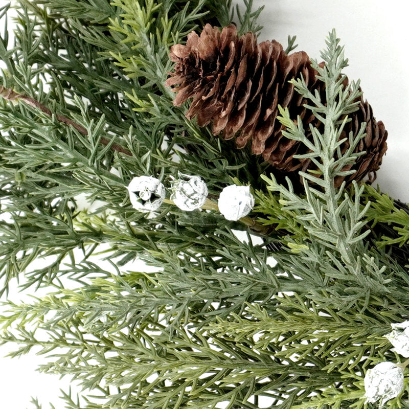 24" Artificial Christmas Wreath as a festive door display