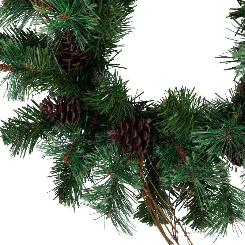 26" Artificial Pine Christmas Wreath hung on a wooden door