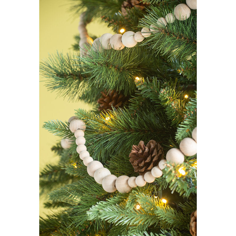 6 ft Pre-Lit Frosted Pine Christmas Garland draped across a fireplace mantel