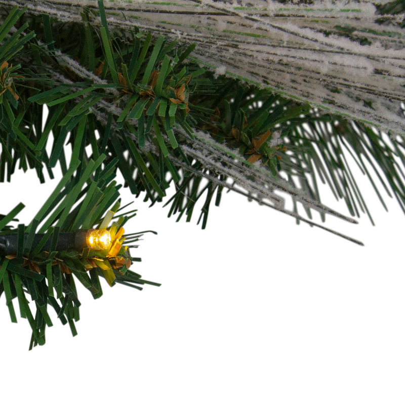 22" Pre-Lit Artificial Ornament Christmas Wreath hanging on a front door