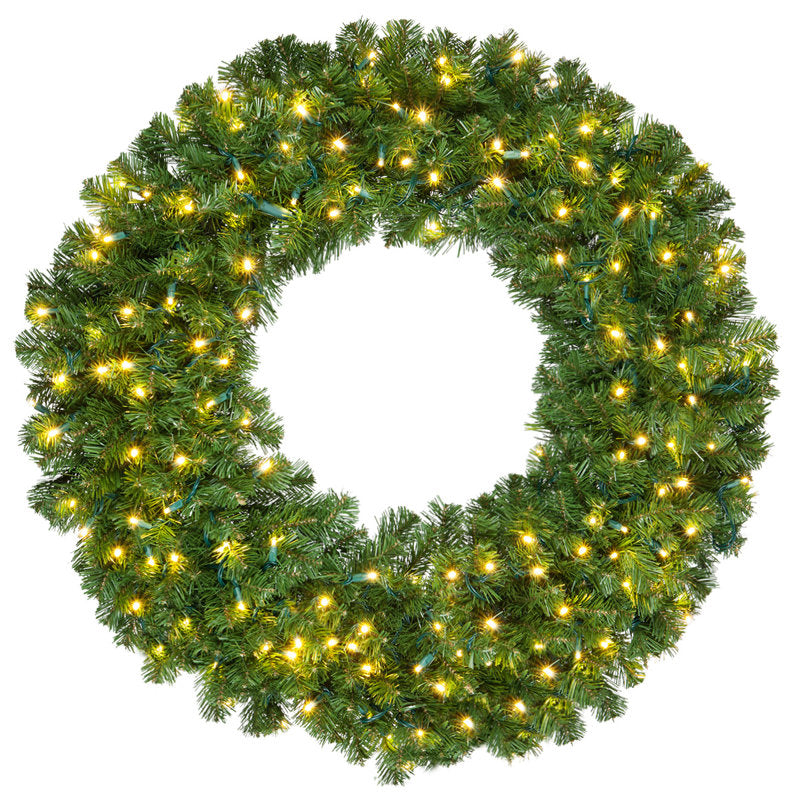 Pre-Lit Artificial Pine Christmas Wreath hung on a wooden door
