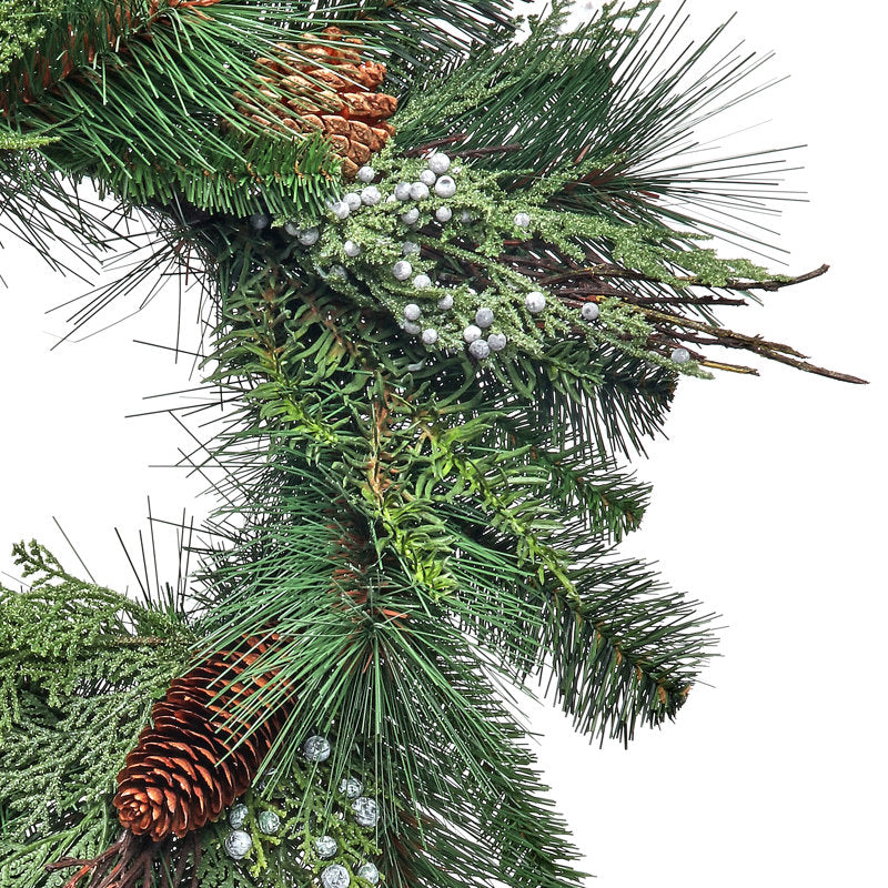 17.7" Artificial Pine Christmas Wreath hung on a wooden door