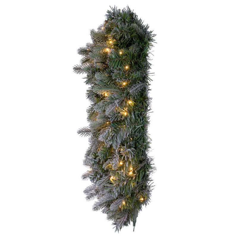 Pine Christmas Wreath hung on a wooden door