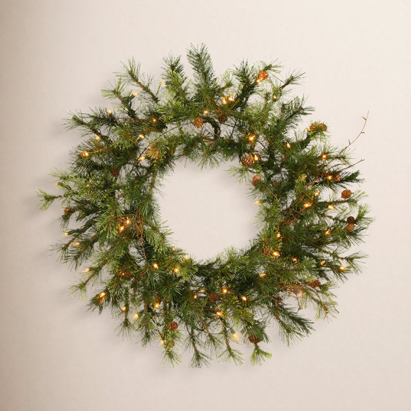 Artificial Pine Christmas Wreath displayed on a front door