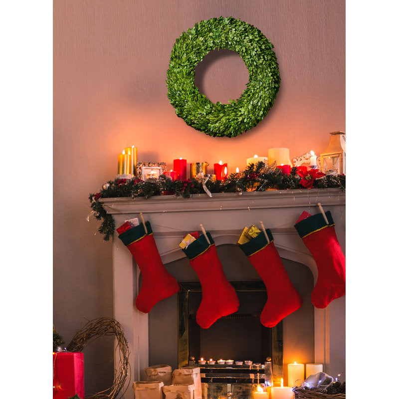 Artificial Christmas Wreath hung on a wooden door