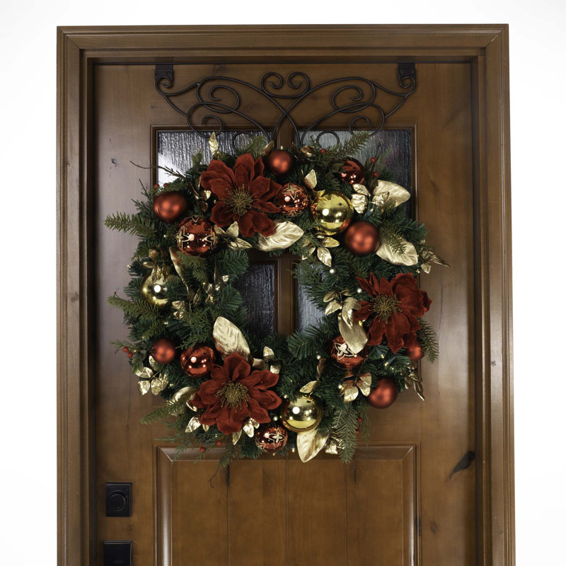 12" Artificial Christmas Wreath displayed on a front door