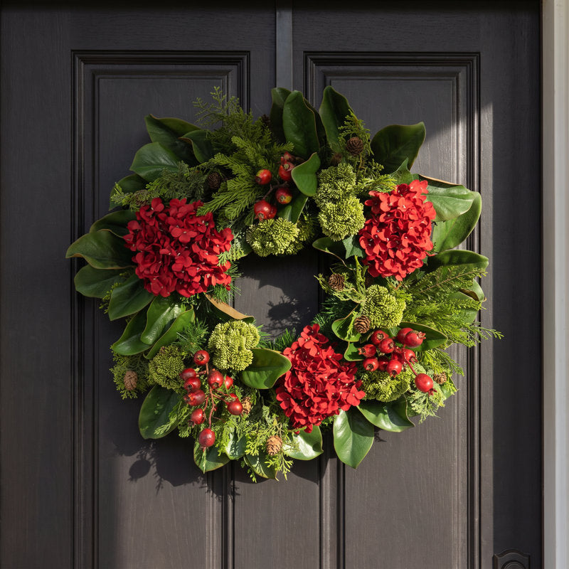 26" Artificial Christmas Wreath hung on a wooden door