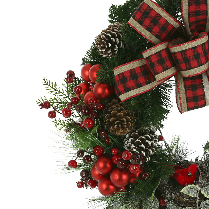 24" Artificial Cedar Christmas Wreath hung on a wooden door