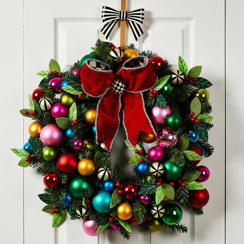 30" Pre-Lit Berry Christmas Wreath hung on a wooden door