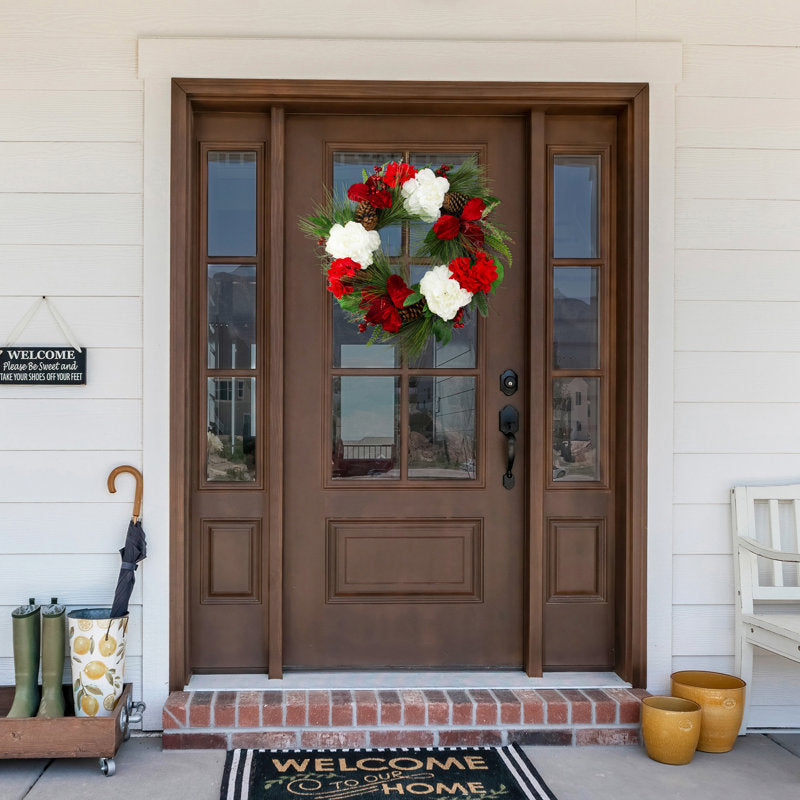 Artificial Berry Christmas Wreath hung on a wooden door