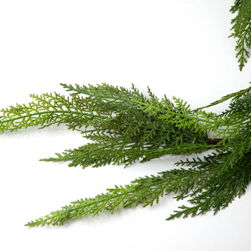 5 ft Pine Christmas Tinsel Garland framing a front doorway
