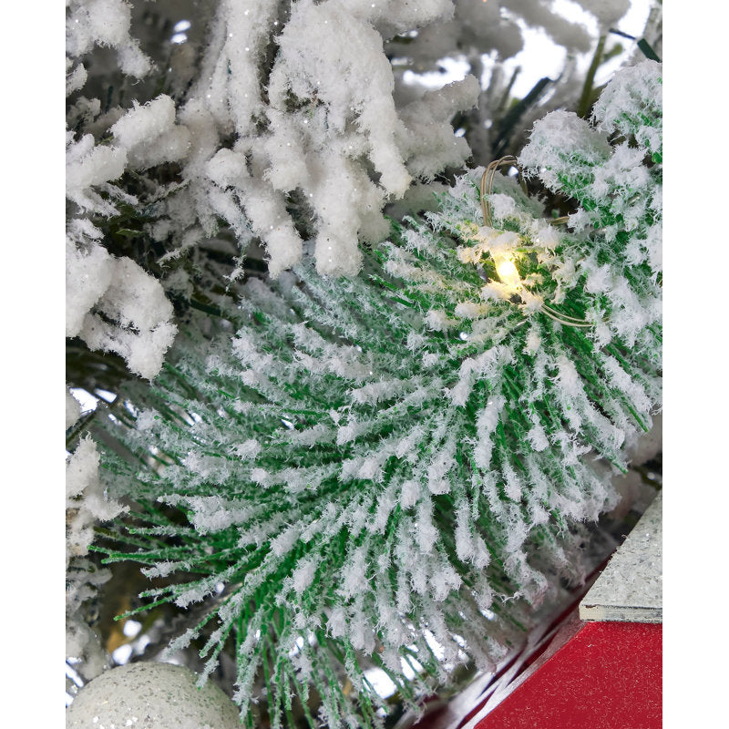 Spruce Christmas Wreath hung on a wooden door