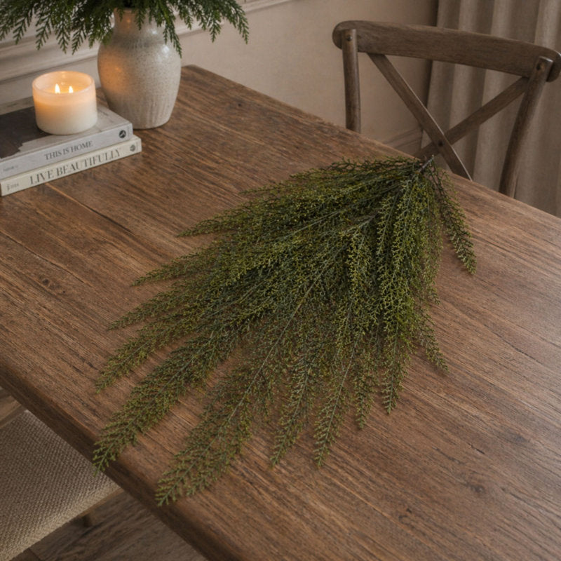 100 ft Christmas Tinsel Garland draped across a fireplace mantel