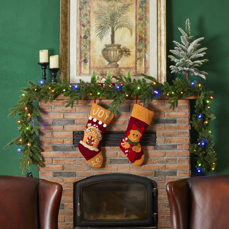 111" Berry Christmas Garland wrapped around a staircase banister