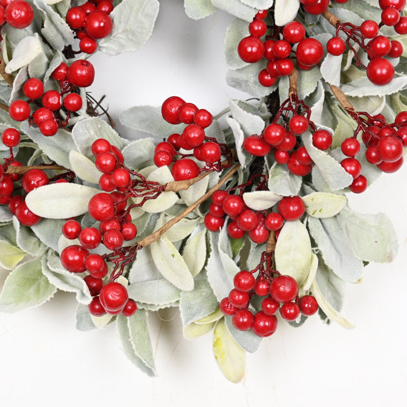 24" Pre-Lit Christmas Wreath hung on a wooden door