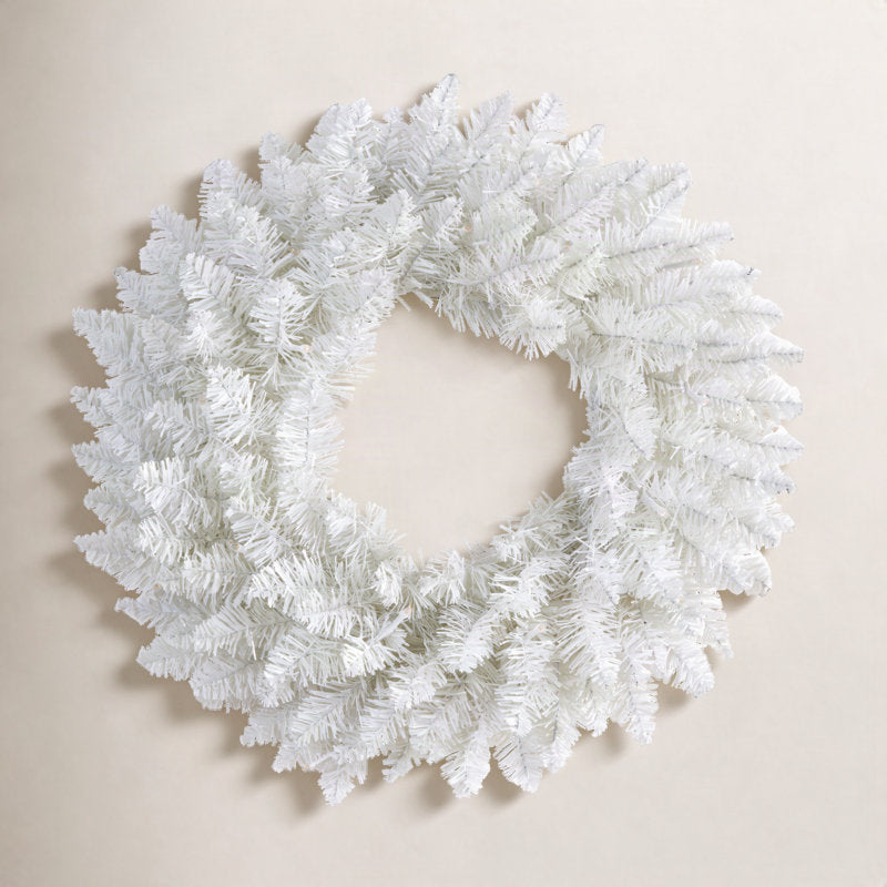 24" Artificial Pine Christmas Wreath hanging on a front door
