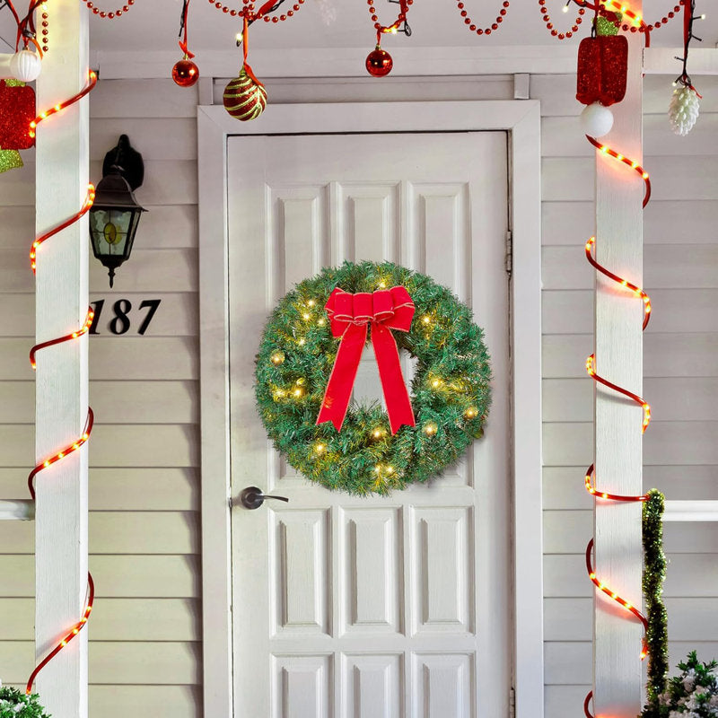 Pre-Lit Christmas Wreath hung on a wooden door