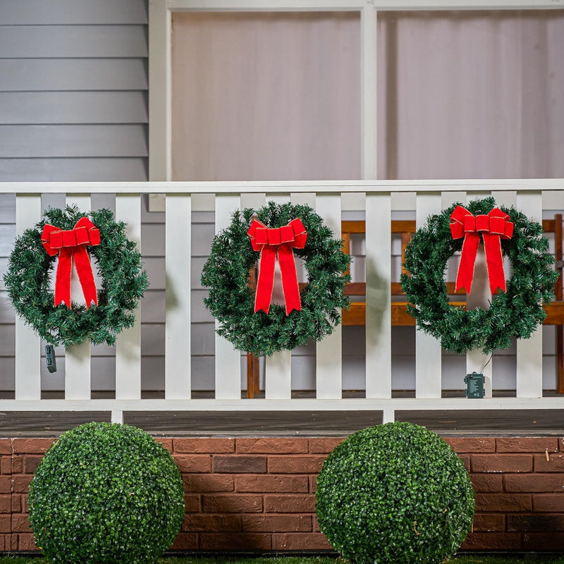 Pre-Lit Christmas Wreath hung on a wooden door