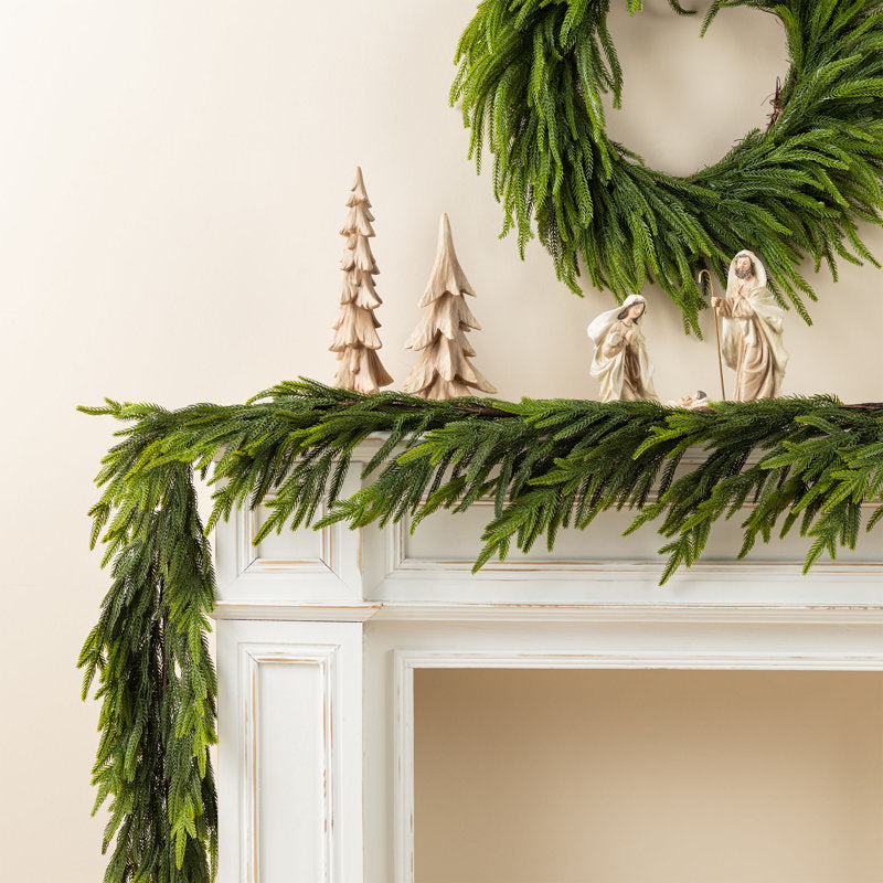 6 ft Pre-Lit Artificial Pine Christmas Garland styled along a festive mantel