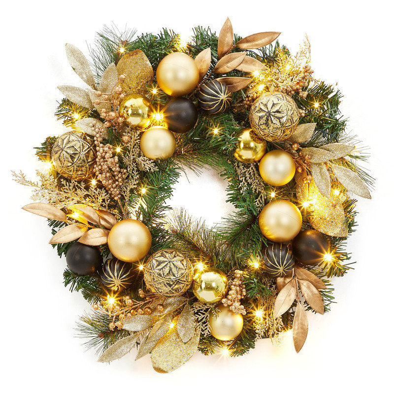22" Pre-Lit Artificial Ornament Christmas Wreath hanging on a front door