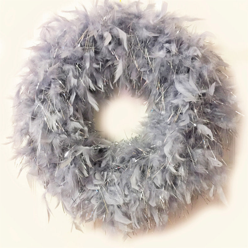 24" Artificial Pine Christmas Wreath hung on a wooden door