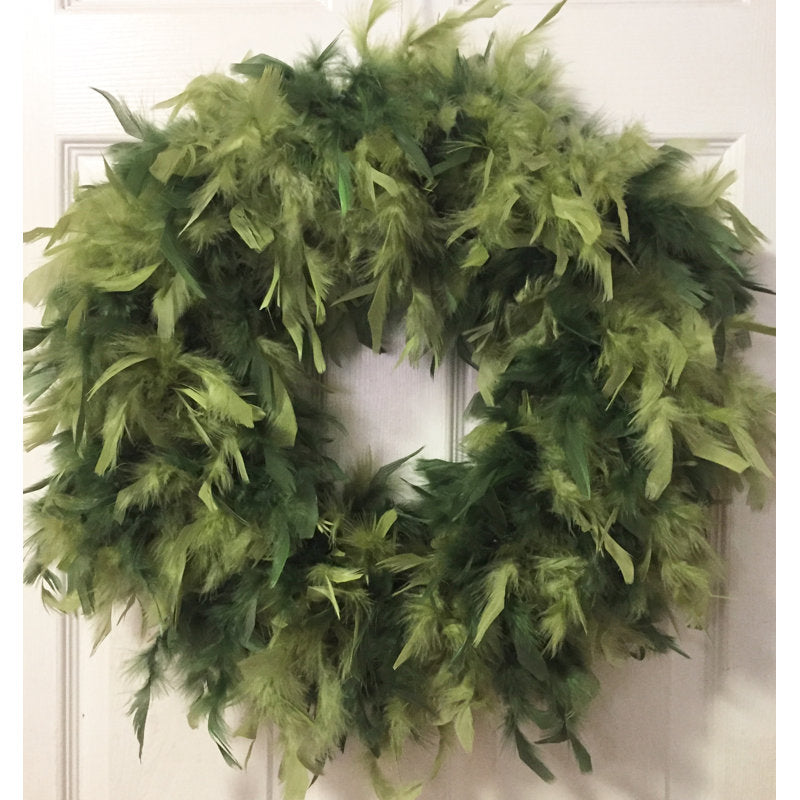 24" Artificial Pine Christmas Wreath hung on a wooden door
