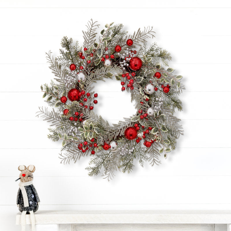 4" Artificial Spruce Christmas Wreath displayed on a front door