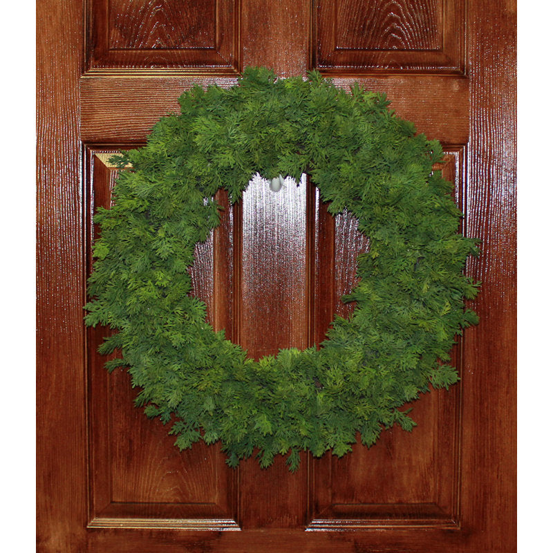 Pine Christmas Wreath hanging on a front door