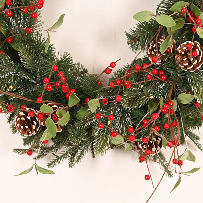 26" Artificial Cedar Christmas Wreath displayed on a front door