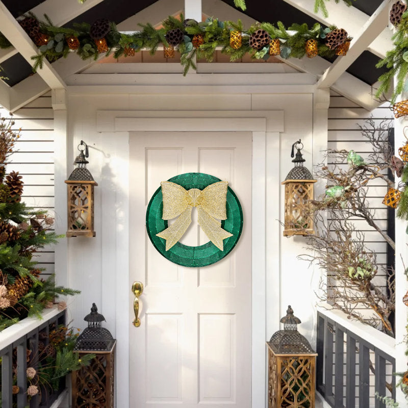 26" Pre-Lit Christmas Wreath hung on a wooden door