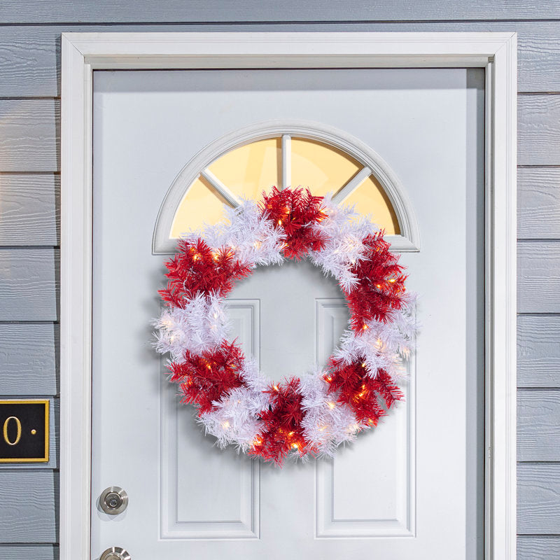60" Pre-Lit Christmas Wreath displayed on a front door