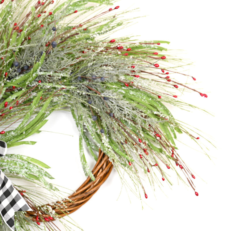 18" Artificial Christmas Wreath hung on a wooden door