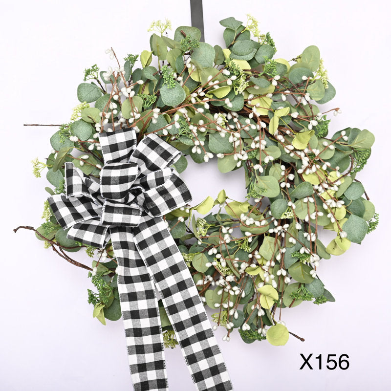 26" Berry Christmas Wreath hung on a wooden door