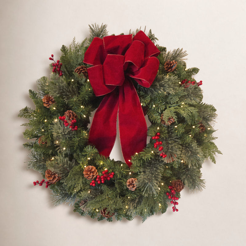 24" Christmas Wreath hung on a wooden door