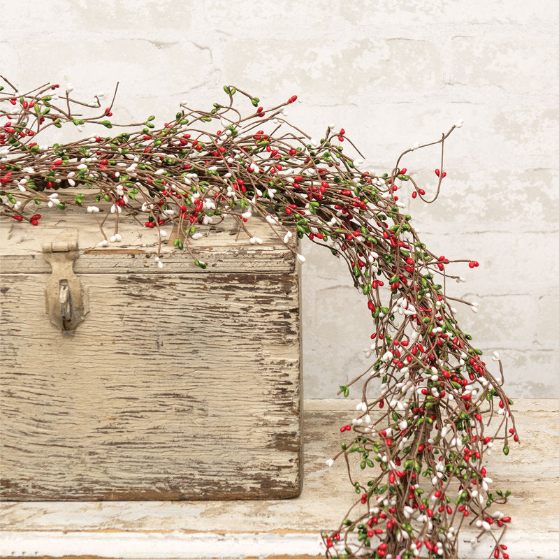 4 ft Artificial Christmas Garland wrapped around a staircase banister