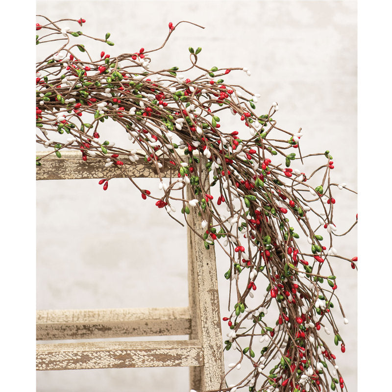 4 ft Artificial Christmas Garland wrapped around a staircase banister