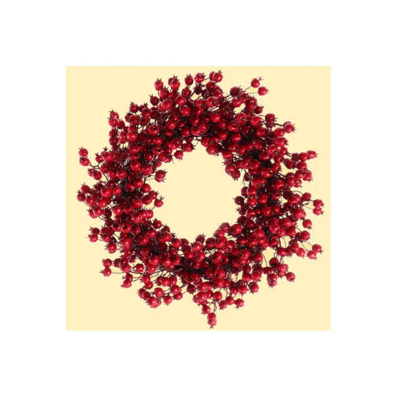 Frosted Christmas wreaths with berries